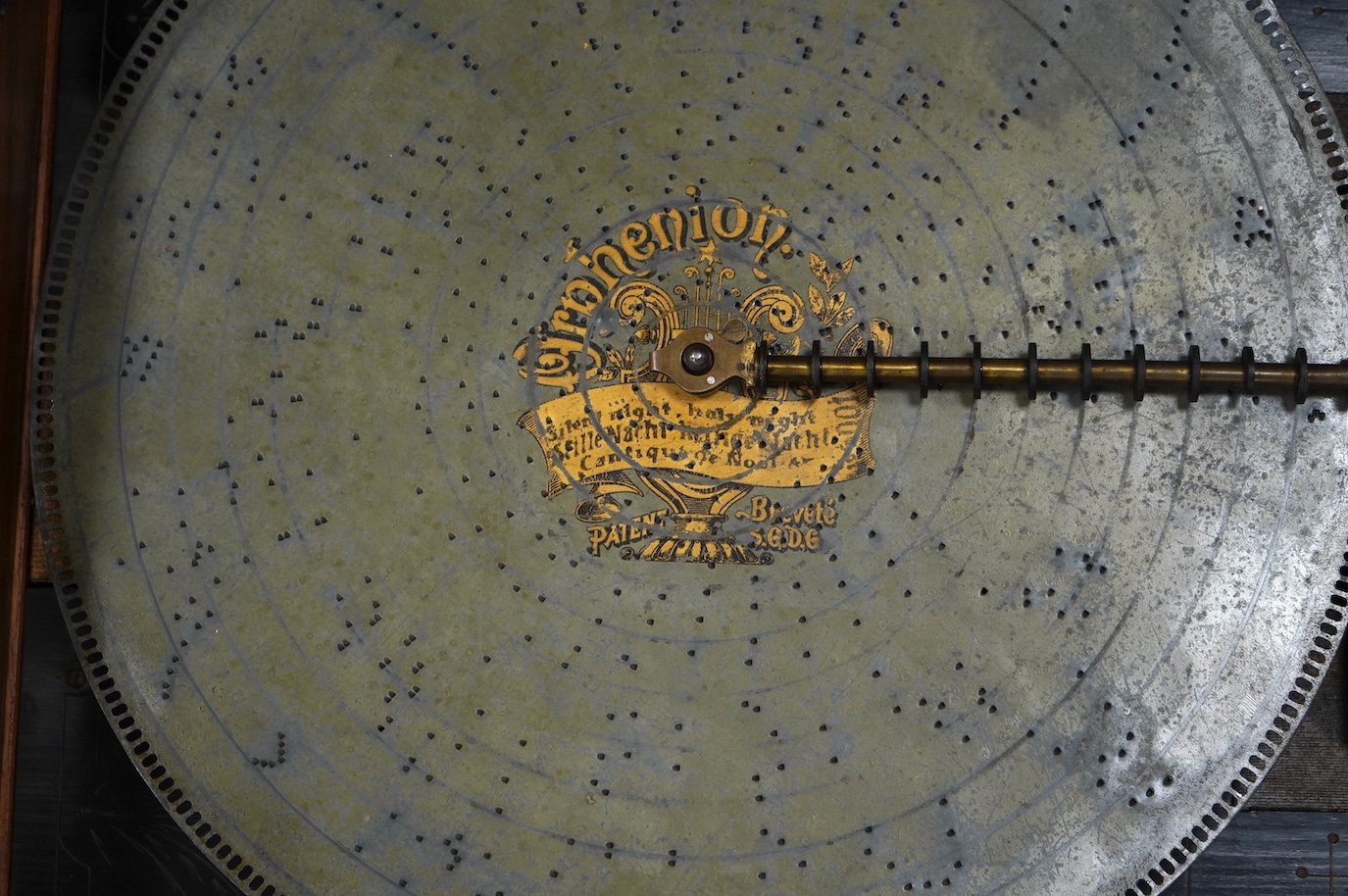 A walnut cased Orphenion, the replacement case is understood to have been constructed from panels from RMS Mauretania, 64cm wide, 49cm deep, 23cm high, with twenty-two 41cm diameter discs. Condition - good.